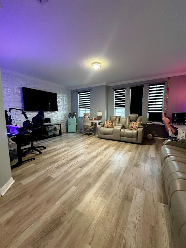 living room with crown molding and hardwood / wood-style floors