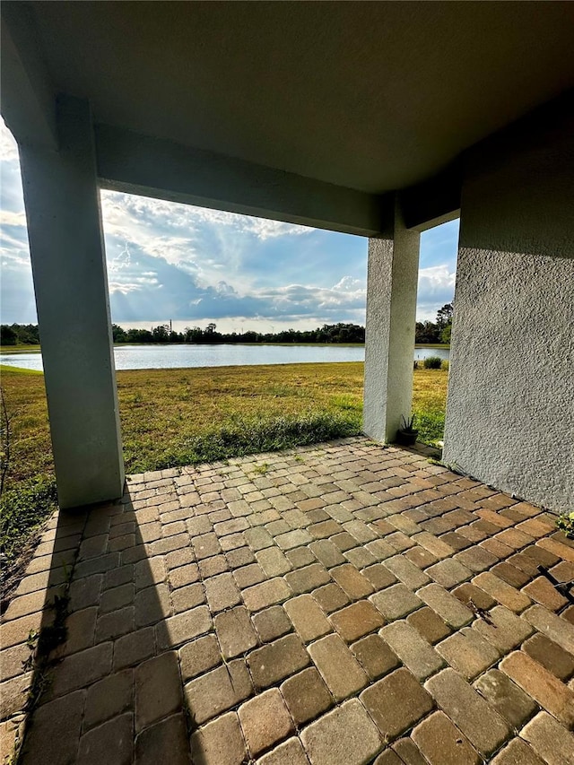 view of patio / terrace with a water view