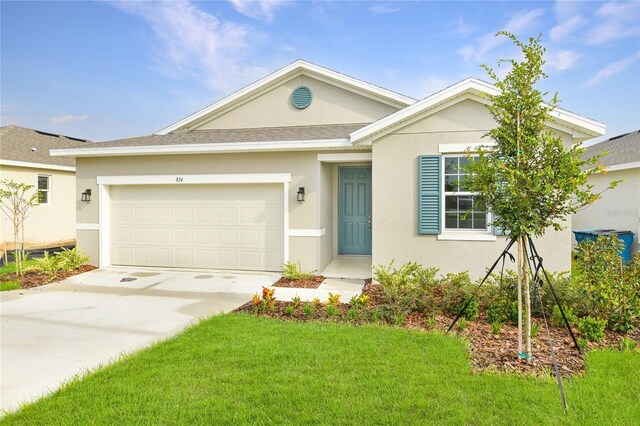 ranch-style home with a front yard and a garage