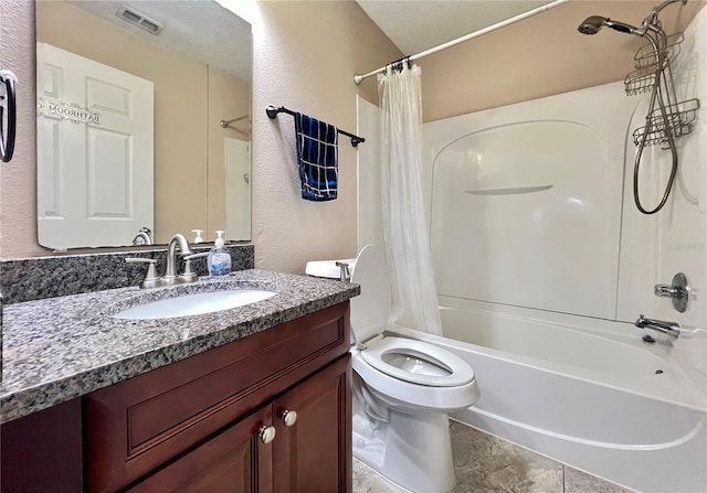 full bathroom with shower / tub combo, vanity, and toilet