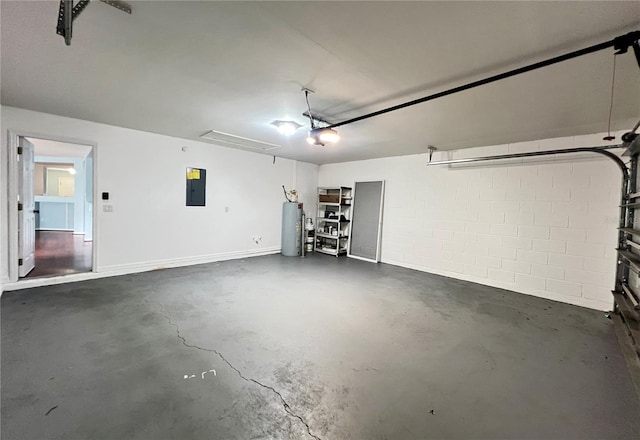 garage featuring electric water heater, electric panel, and a garage door opener