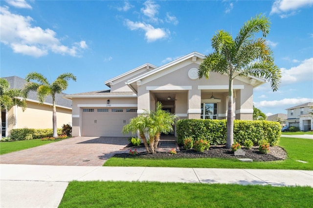 view of front facade with a front yard and a garage