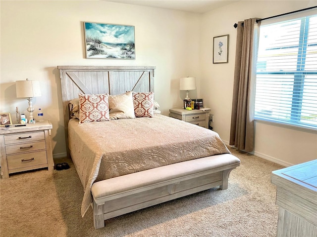 bedroom featuring light carpet