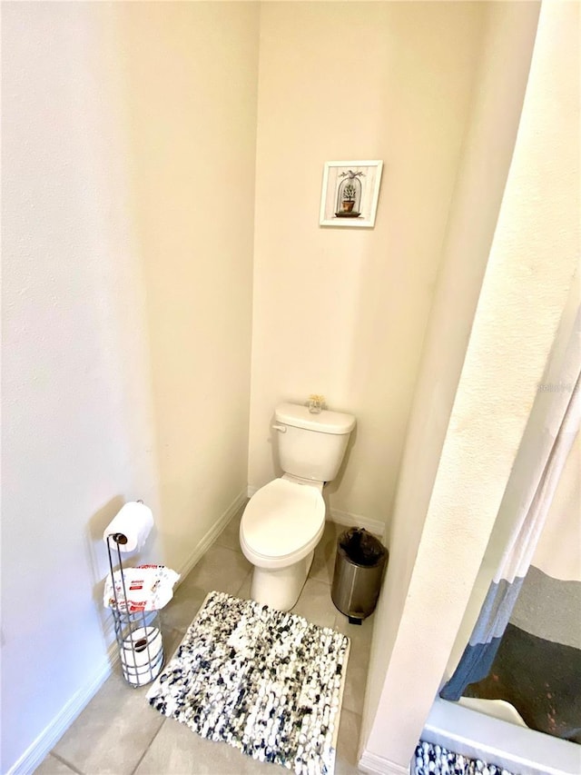 bathroom with tile patterned floors and toilet