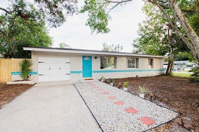 ranch-style home featuring a garage