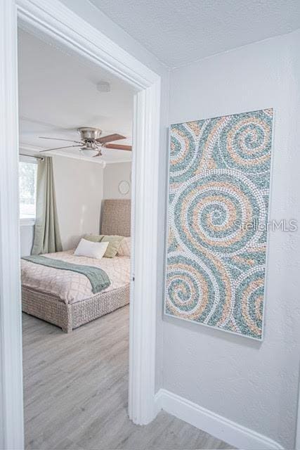 bedroom featuring hardwood / wood-style floors and ceiling fan