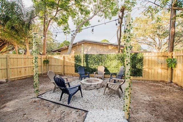 view of patio with an outdoor fire pit