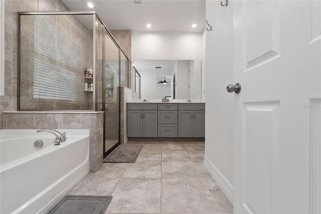 bathroom featuring dual bowl vanity, tile patterned floors, and separate shower and tub