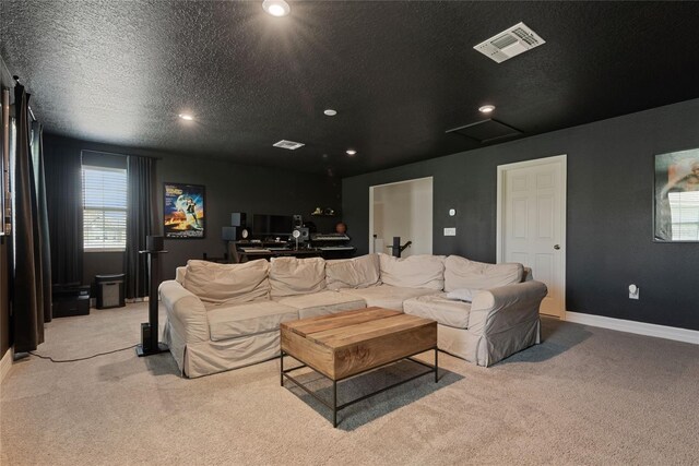 living room featuring light carpet and a textured ceiling