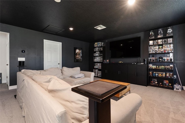 interior space with a textured ceiling and light colored carpet