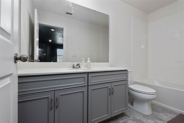 full bathroom featuring vanity, shower / washtub combination, tile patterned flooring, and toilet