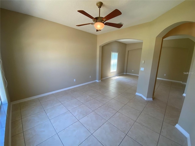 unfurnished room featuring ceiling fan and light tile flooring