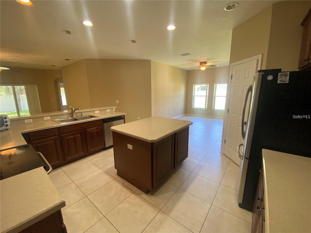 kitchen with sink, plenty of natural light, ceiling fan, and stainless steel appliances