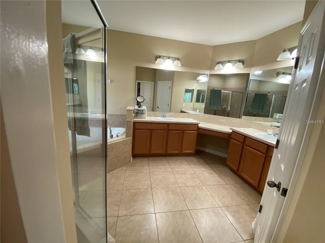 bathroom with tile floors, separate shower and tub, and vanity