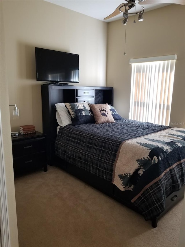 carpeted bedroom with ceiling fan