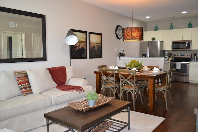 living room featuring dark wood-type flooring