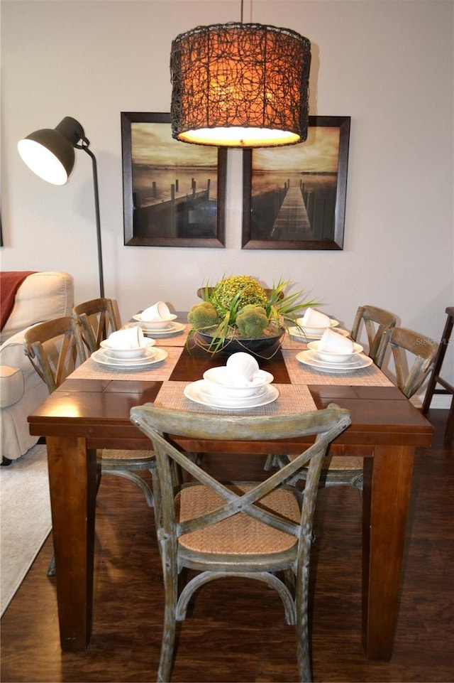 dining area with dark hardwood / wood-style flooring