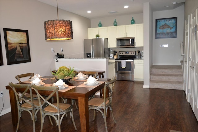 dining space with dark wood-type flooring