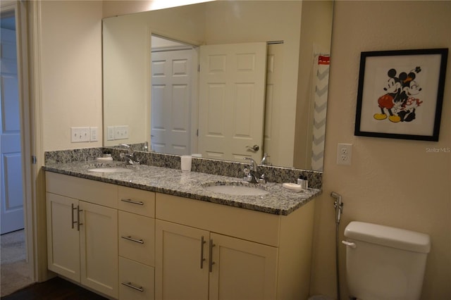 bathroom with vanity and toilet