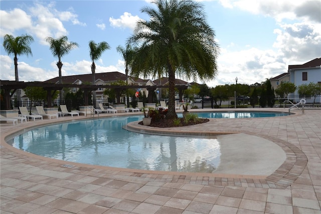 view of swimming pool with a patio area