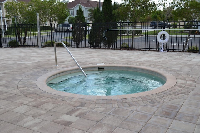 view of pool featuring a community hot tub