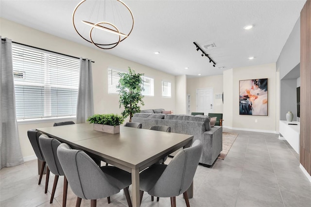 dining room with track lighting