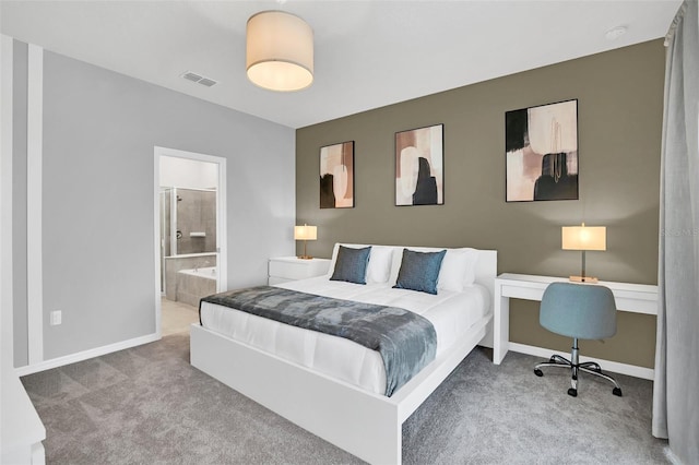 bedroom featuring carpet flooring and ensuite bath