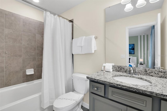 full bathroom with vanity, toilet, and shower / bath combo with shower curtain