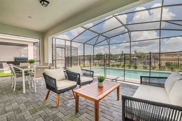 view of patio / terrace featuring an outdoor hangout area, a fenced in pool, and glass enclosure