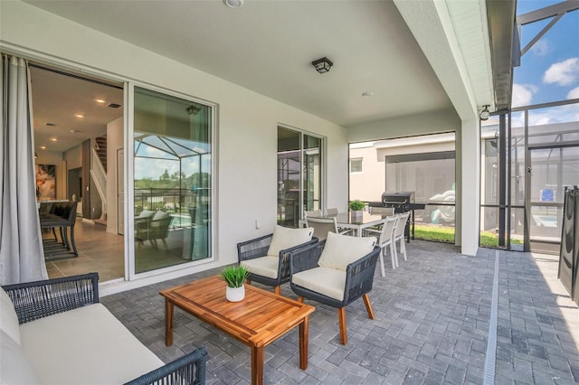 view of patio featuring a lanai