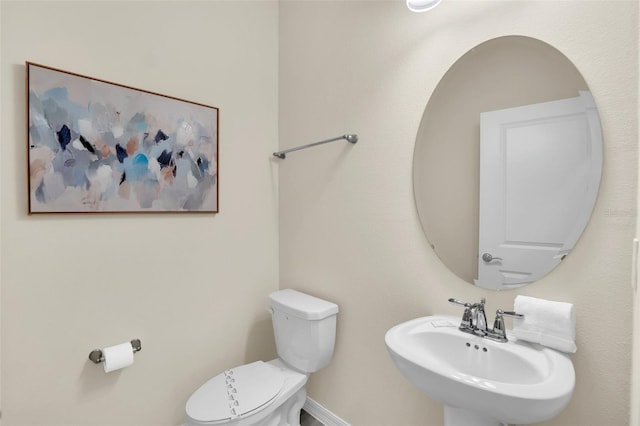 bathroom featuring sink and toilet