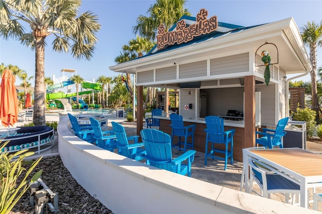 view of patio featuring a bar