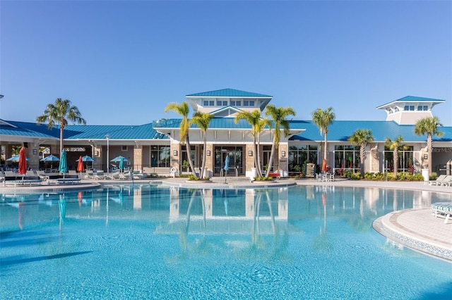 view of swimming pool featuring a patio area