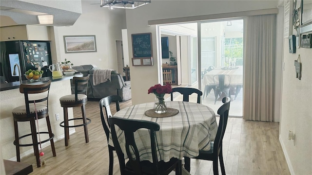 dining space featuring light hardwood / wood-style flooring