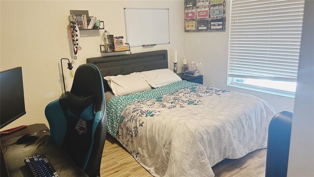 bedroom featuring hardwood / wood-style flooring