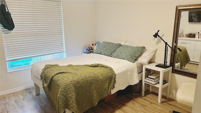 bedroom featuring wood-type flooring