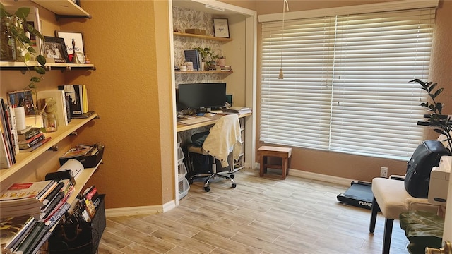 office area with light hardwood / wood-style floors