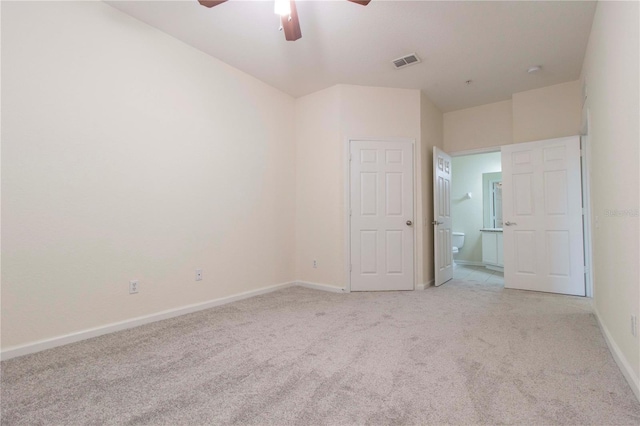 unfurnished bedroom with light colored carpet and ceiling fan