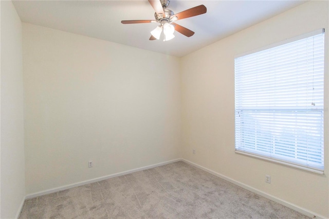 carpeted empty room with ceiling fan