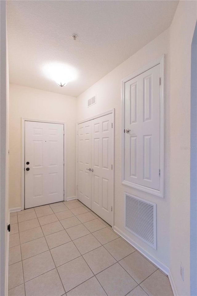 view of tiled foyer entrance