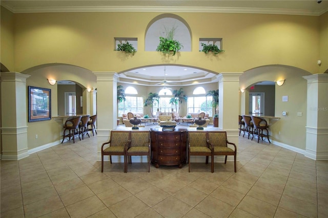 interior space featuring decorative columns and crown molding