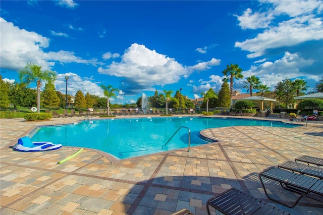 view of swimming pool featuring a patio area