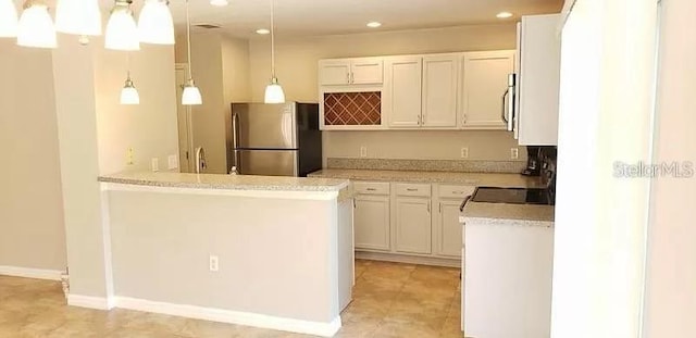 kitchen with white cabinetry, stainless steel appliances, kitchen peninsula, decorative light fixtures, and light tile flooring