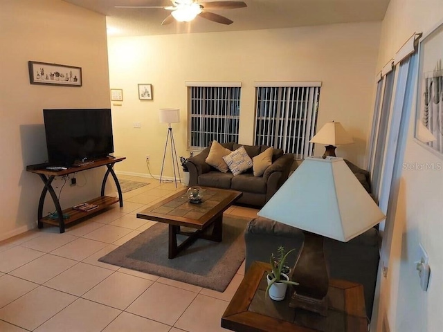 living room featuring ceiling fan and light tile floors