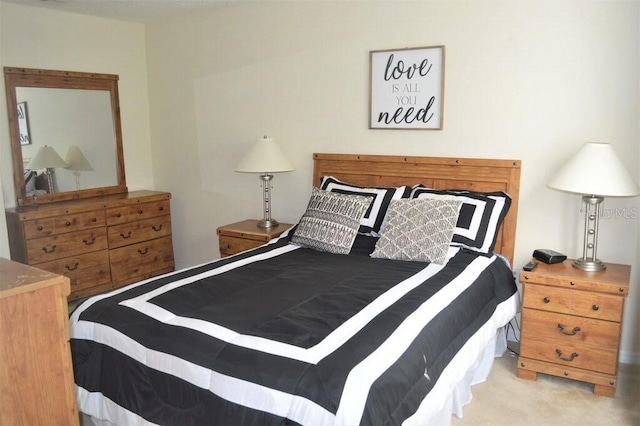 bedroom with light colored carpet