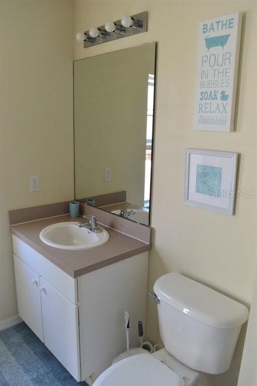 bathroom with vanity and toilet