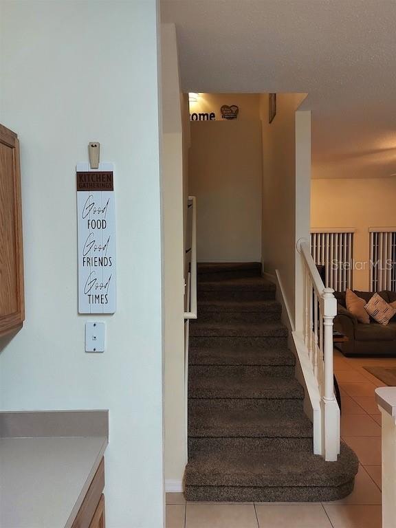 stairway with tile flooring