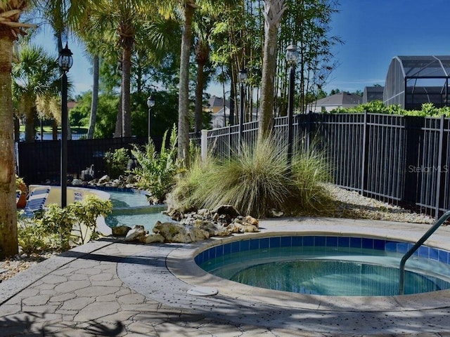 view of pool featuring a lanai