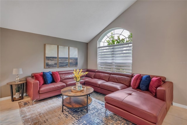 tiled living room featuring vaulted ceiling