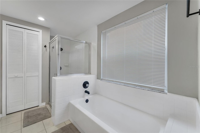 bathroom with tile patterned floors and plus walk in shower